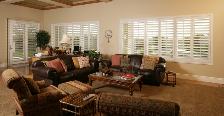 Destin sunroom with french door shutters.